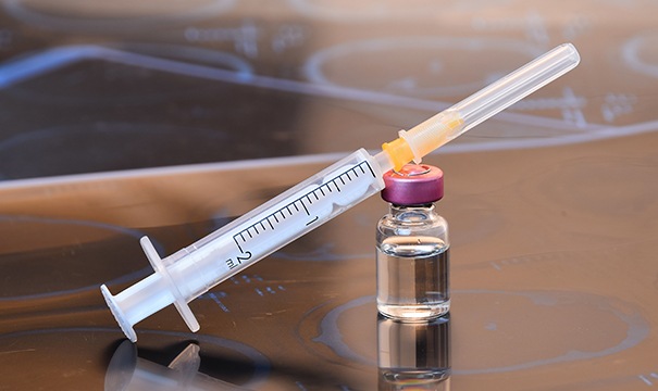 BOTOX vial and syringe sitting on table