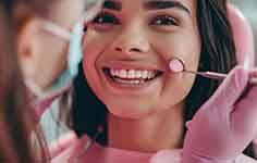 a patient smiling after undergoing gum grafting