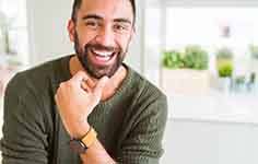 a man smiling with healthy teeth and gums