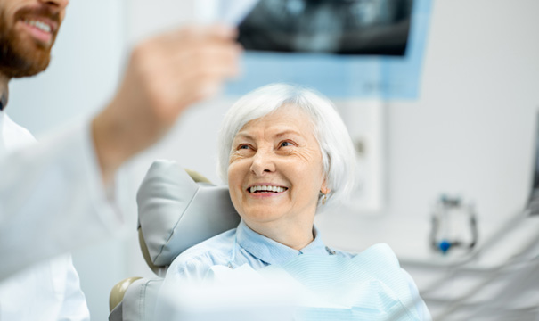 entist showing patient her X-rays  